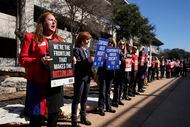 Cindy Haddock, a flight attendant with Southwest Airlines, rallies for higher wages and...