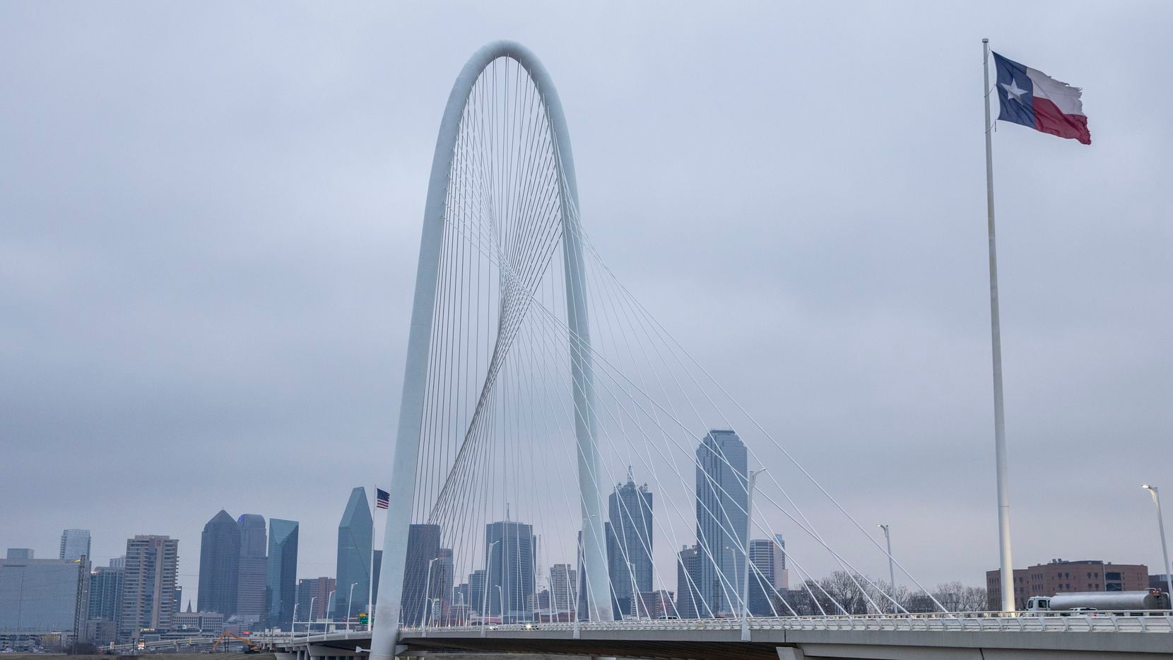 Cold, gray skies hung over the Dallas skyline in advance of what's expected to be a major...