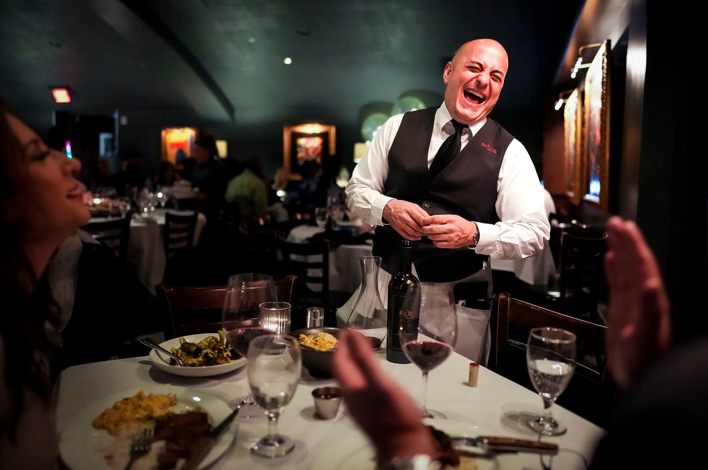 Longtime Nick & Sam's server Benny Bajrami laughs with guests Jimmie and Melinda Dale. He's...