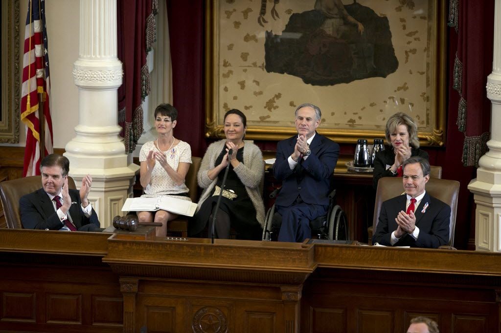 From left, Lt. Gov. Dan Patrick, Tx. Senator Donna Campbell, Texas First Lady Cecilia Abbott, Gov. Greg Abbott. former Rep. Susan L. King and Speaker of the House Joe Straus applaud military members during the Texas Fallen Heroes Memorial Ceremony at the Capitol in Austin, Texas on Saturday, May 23, 2015. 