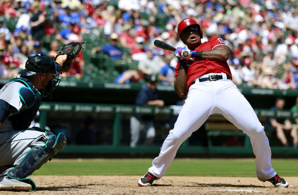 Texas Rangers third baseman Adrian Beltre (29) leans away from an inside pitch by Seattle...