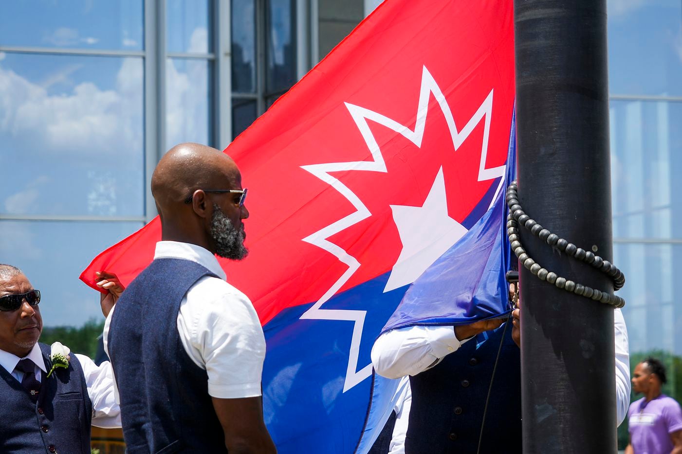 The Juneteenth flag is raised at Fort Worth City Hall at the conclusion of the 2022 Opal's...