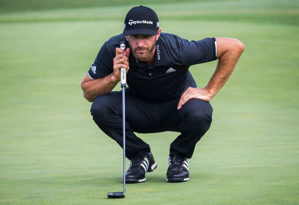 Dustin Johnson lines up a putt on the eighteenth green during round three of the AT&T Byron...
