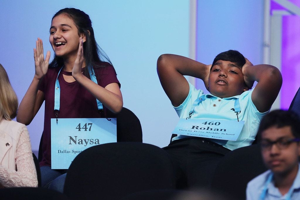 Naysa Modi (left) of Frisco and Rohan Raja of Irving react to the news that they have...