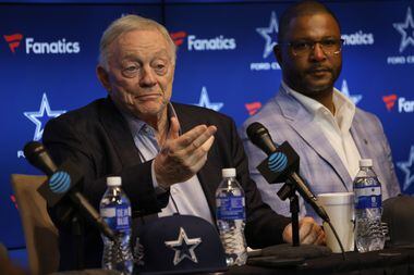Dallas Cowboys owner and general manager Jerry Jones, left, answers the question of a media...