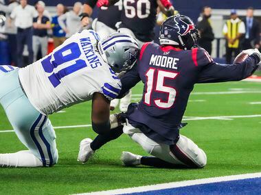 Houston Texans wide receiver Chris Moore (15) is stopped short of the end zone by Dallas...