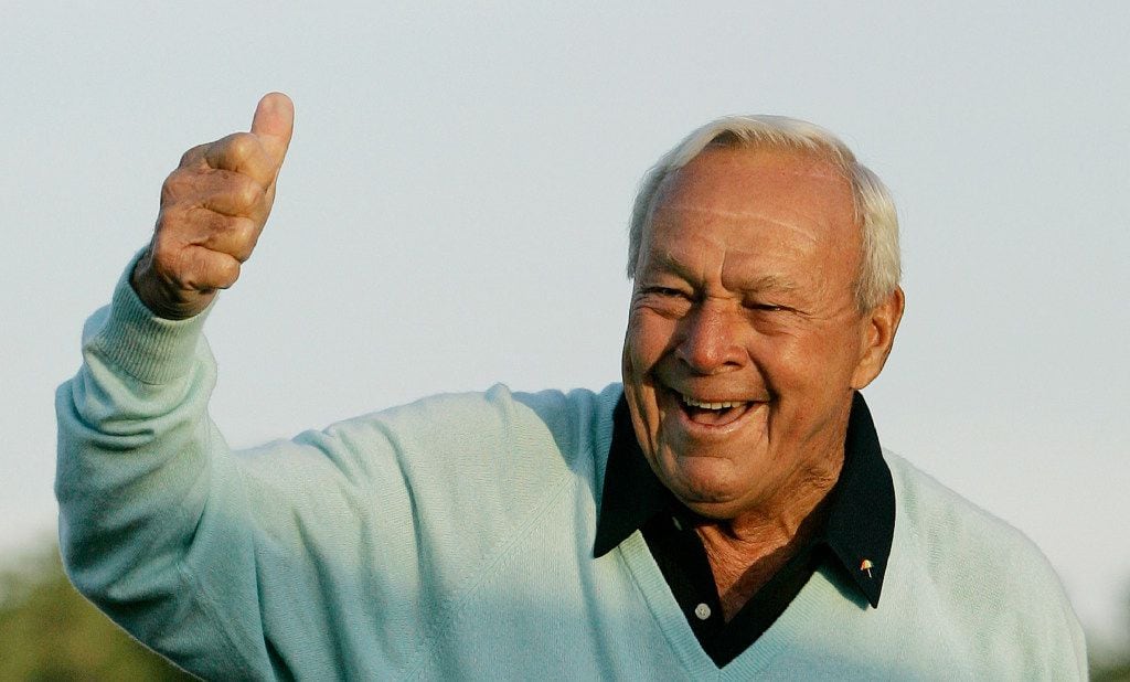 Arnold Palmer acknowledges the crowd after hitting the ceremonial first tee shot prior to...