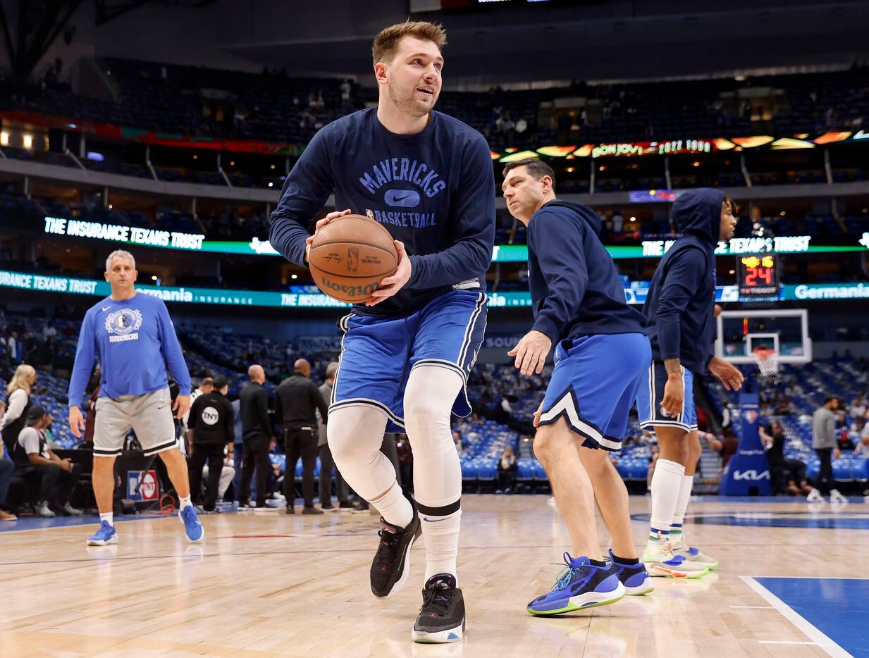 Dallas Mavericks guard Luka Doncic warms up with shooting coach Peter Patton before Game 5...