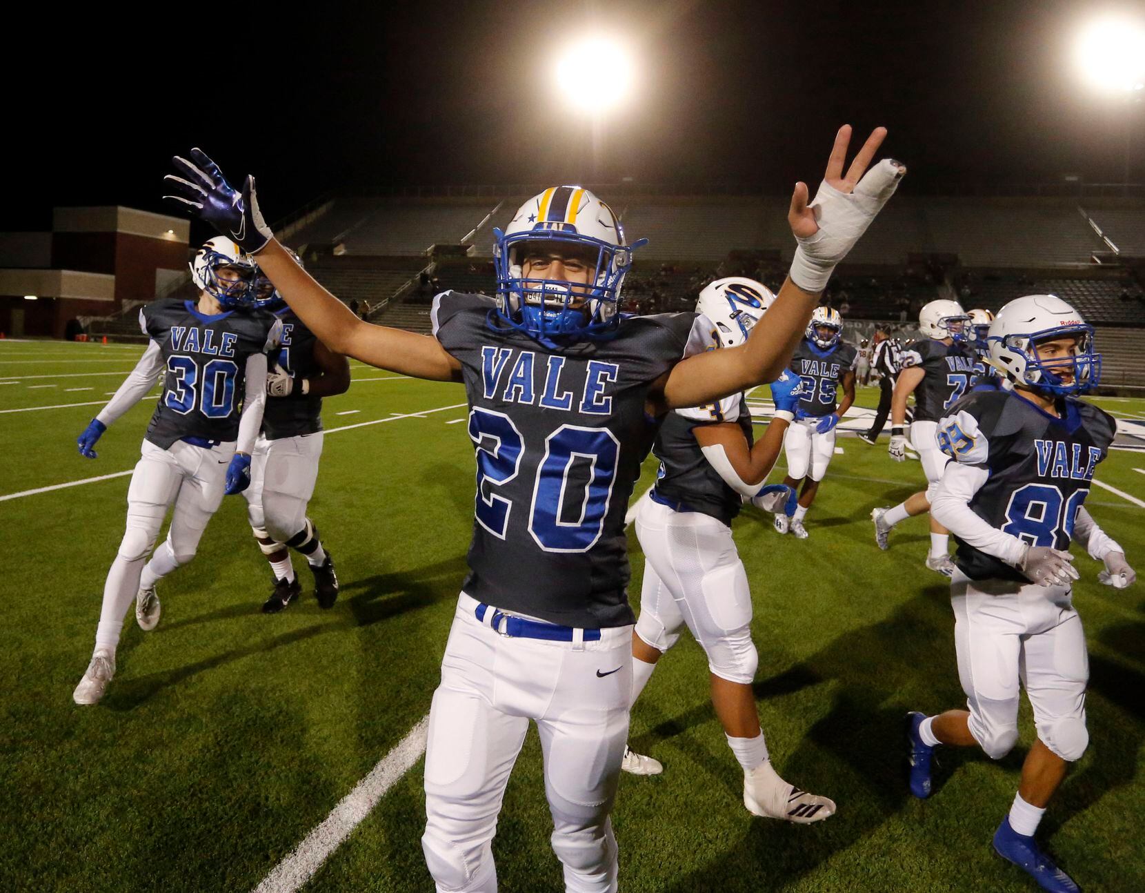 Sunnyvale’s Ricardo Dominguez (20) and teammates celebrate at the end of their 41-27 playoff...