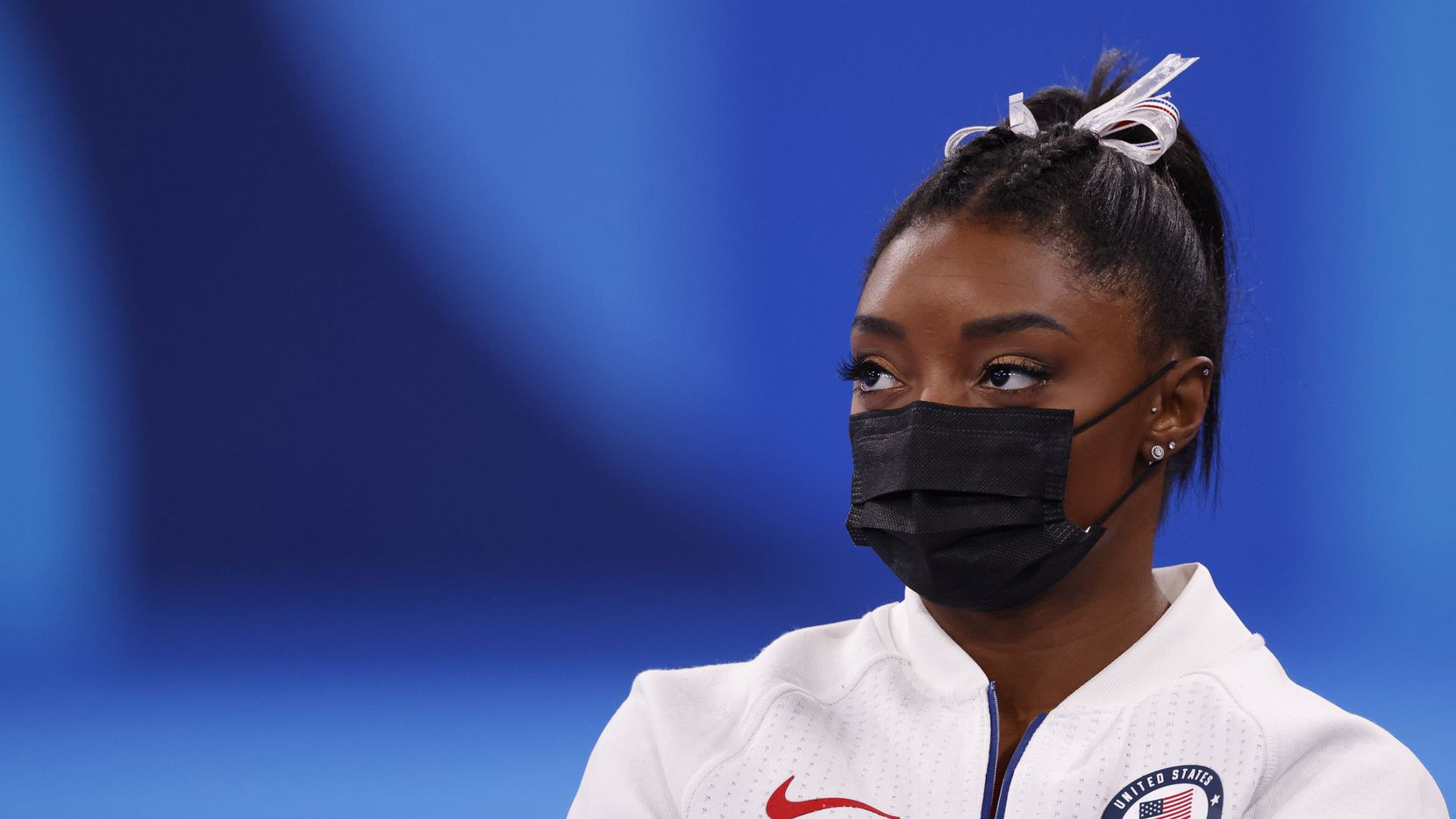 USA’s Simone Biles watches after pulling out of the competition after the vault event during...