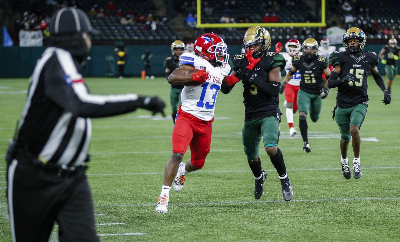 Duncanville senior running back Roderick Daniels Jr. (13) battles DeSoto junior safety Devyn Bobby (3) for yardage during the first half of a Class 6A Division I Region II final high school football game, Saturday, January 2, 2021.  Duncanville won 56-28. (Brandon Wade/Special Contributor)