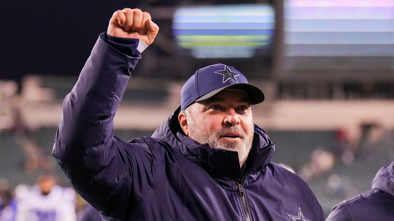 Dallas Cowboys head coach Mike McCarthy pumps his fist to the crowd as he leaves the field after a 51-26 victory over the Philadelphia Eagles in an NFL football game at Lincoln Financial Field on Saturday, Jan. 8, 2022.