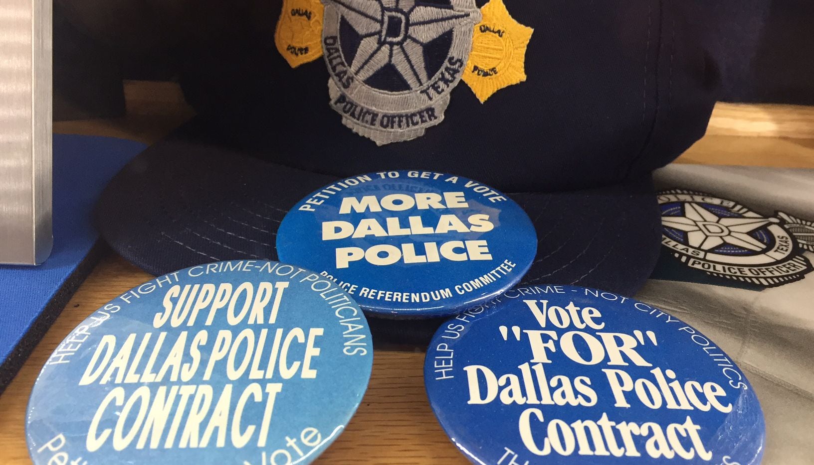 Buttons on display at the Dallas Police Association's headquarters reveal some of the...