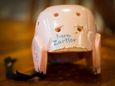 A padded helmet, which is used by the family to help protect Kara Zartler when she goes into...