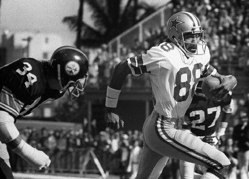 FILE - Dallas Cowboys wide receiver Drew  Pearson (88, right) eludes Pittsburgh Steelers...