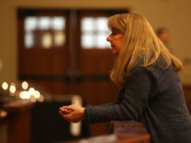 The Rev. Laura Echols-Richter prays in the sanctuary at Grace Avenue United Methodist Church in Frisco during a come-and-go service for its members after the denomination voted to retain anti-LGBTQ tenets at a special meeting this week in St. Louis.