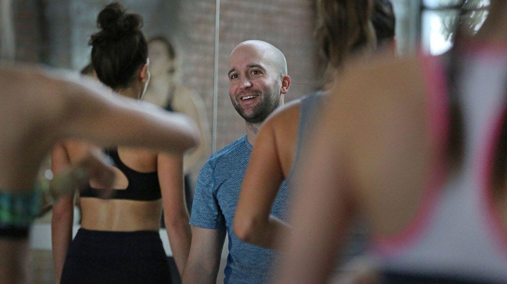 Dallas fitness trainer John Benton, who
has been dubbed the "hips whisperer" for his ability to get his clients into unbelievable shape, holds a class in Dallas.