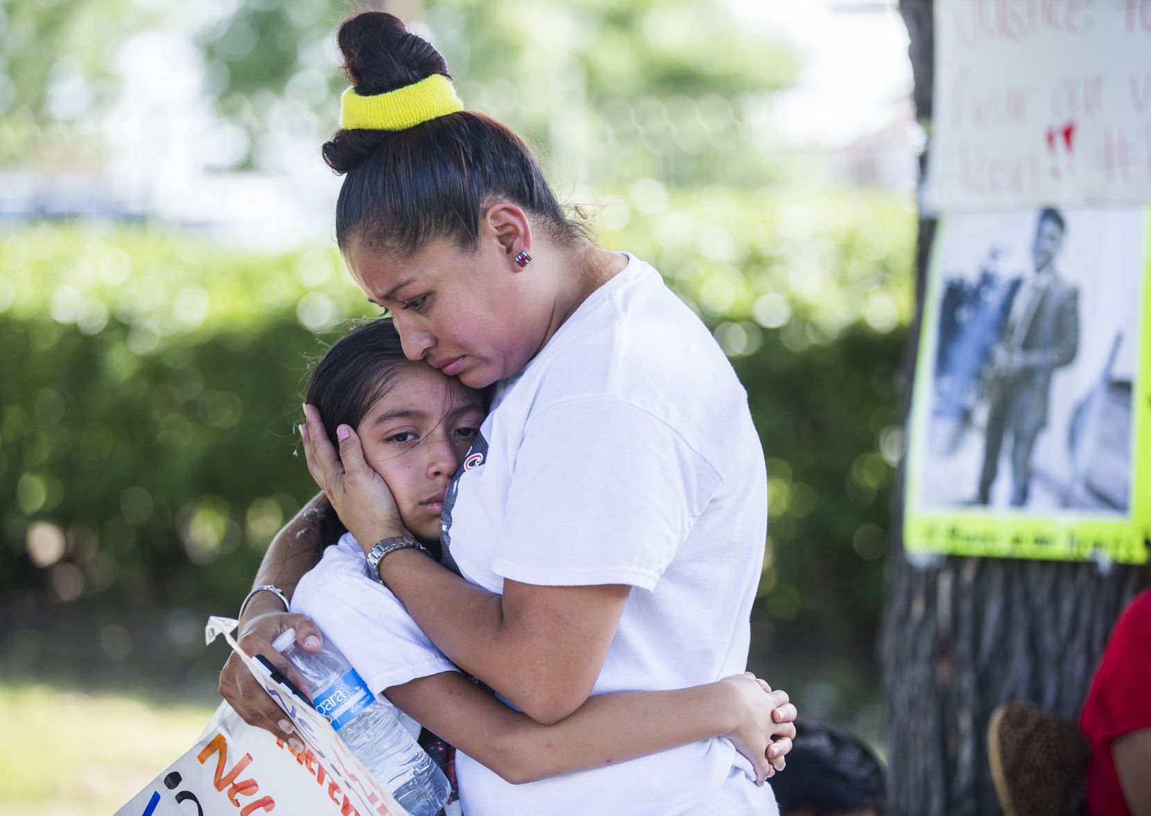 Jose Cruz's mother, Ana Henriquez, comforts Cruz's sister, Stephanie Eschriche, near Cruz's...