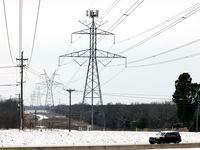 Large electrical transmission lines cross over SH 287 in South Arlington, Wednesday,...