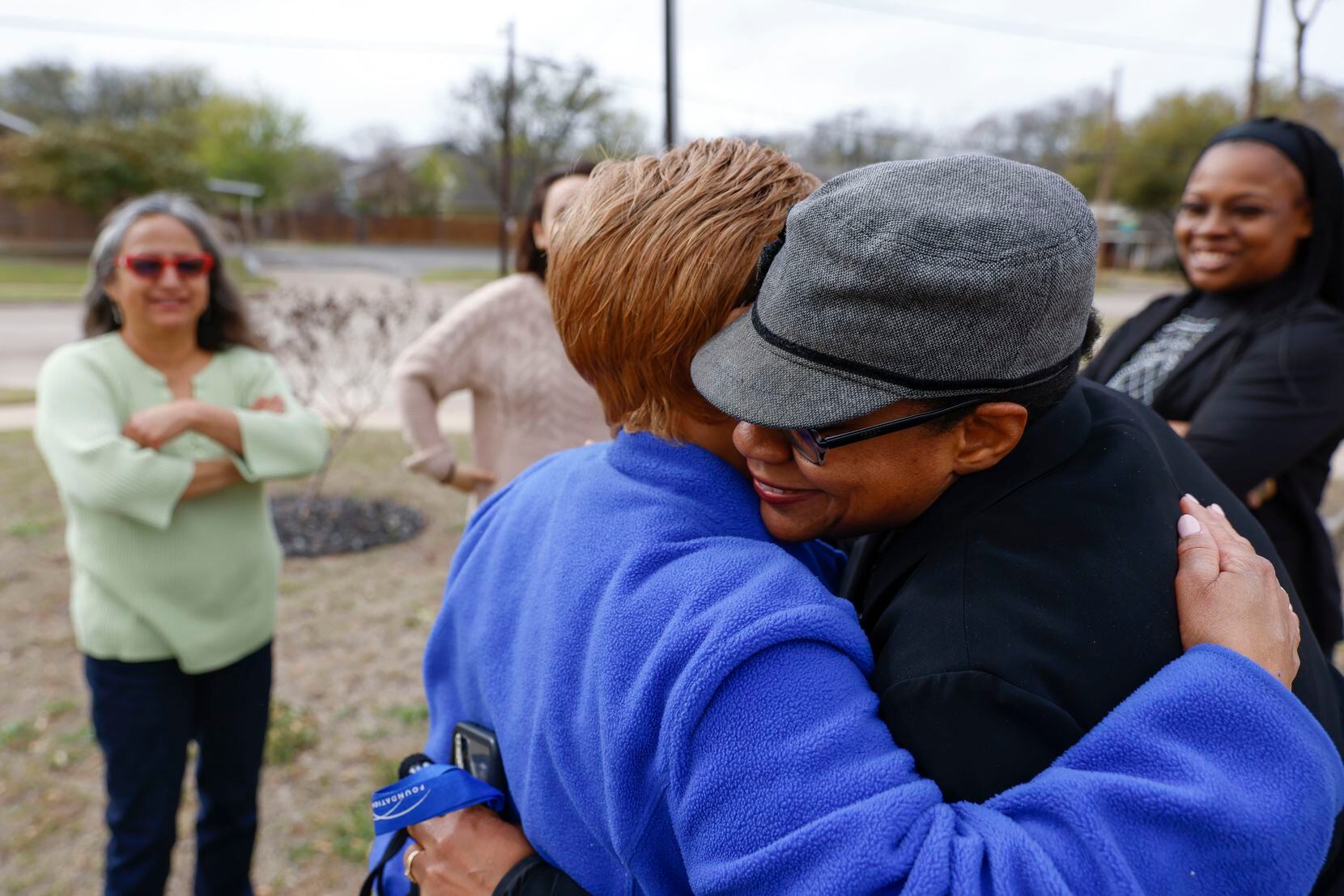 Longtime Mckinney resident Rosa Maxie (left front) embraced Beth Bentley on Tuesday, March...