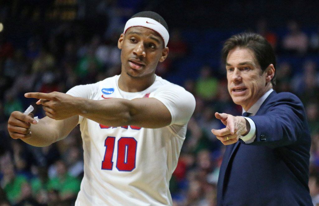 SMU guard Jarrey Foster (10)confers with coach Tim Jankovich in the second half during the...