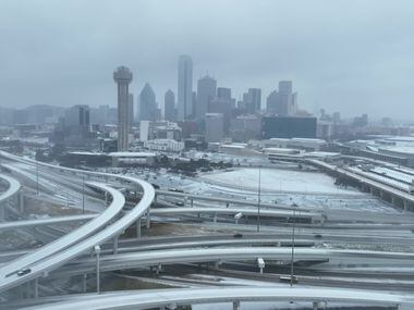 The Dallas skyline turned white after a winter storm on Tuesday, Jan. 31, 2023.