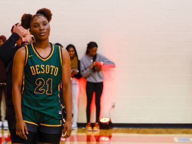 DeSoto shooting guard MaRiya Vincent (21) watches Montverde Academy players celebrate their...