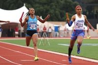 Duncanville sprinter Sanyah Keeton, right, finishes strong as the anchor leg for her...