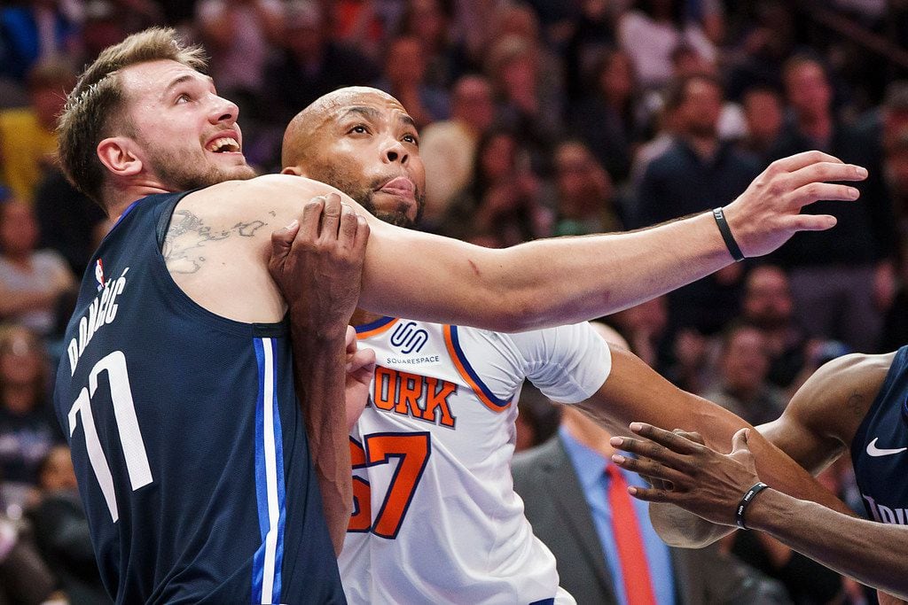 Dallas Mavericks guard Luka Doncic (77) fights for position against New York Knicks forward Taj Gibson (67) during the second half of an NBA basketball game at American Airlines Center on Friday, Nov. 8, 2019, in Dallas. (Smiley N. Pool/The Dallas Morning News)