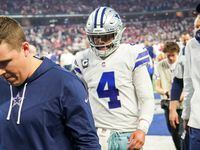 Dallas Cowboys offensive coordinator Kellen Moore and quarterback Dak Prescott leave the...