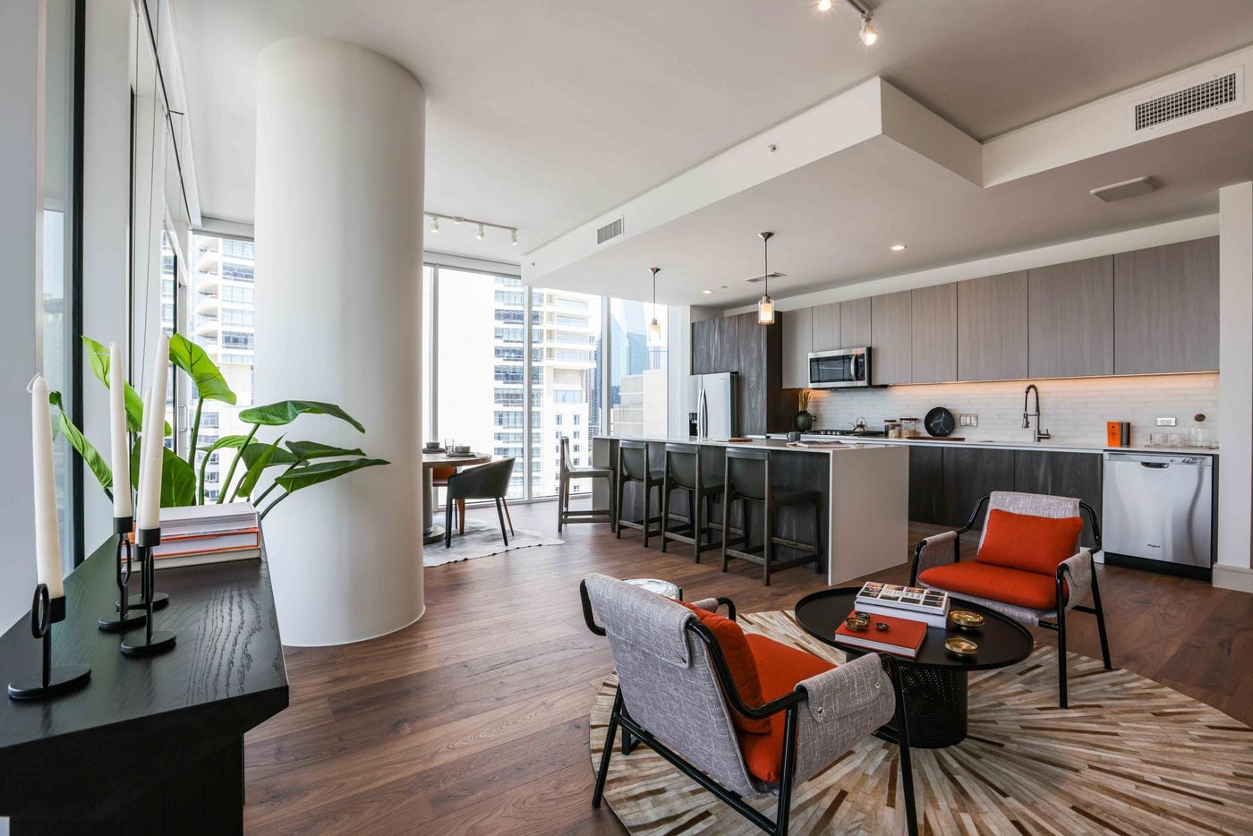 Kitchen and living room in a 2 beds 2 bath apartment at The Victor. (Lola Gomez / The Dallas Morning News)