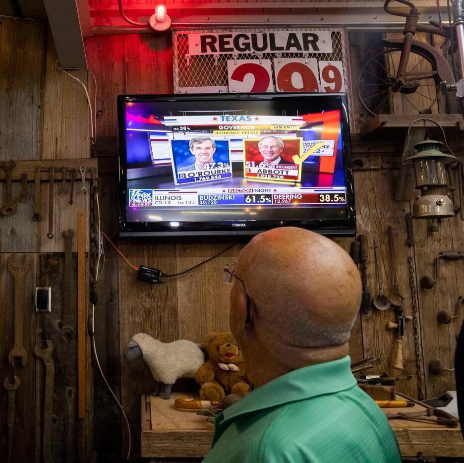 A TV tuned to Fox News shows Governor Greg Abbott as the winner over Democratic challenger...