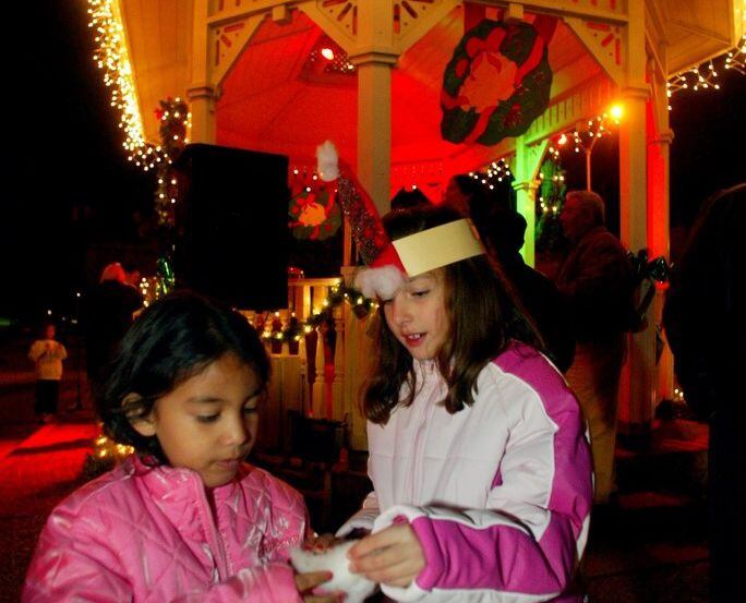 Children make paper hats at Mesquite's Christmas on the Square.