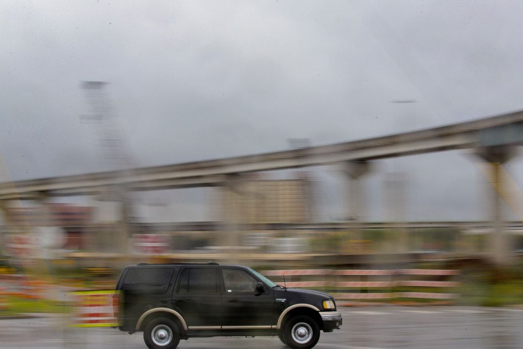 A truck drives past a bridge under construction near Texas State Highway 360 and Interstate...