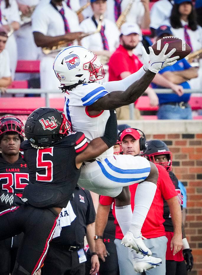 SMU wide receiver Rashee Rice (11) makes a leaping catch over Lamar Cardinals defensive back...