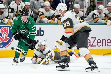 Dallas Stars center Radek Faksa (12) looks to take control of the puck in front of Vegas...