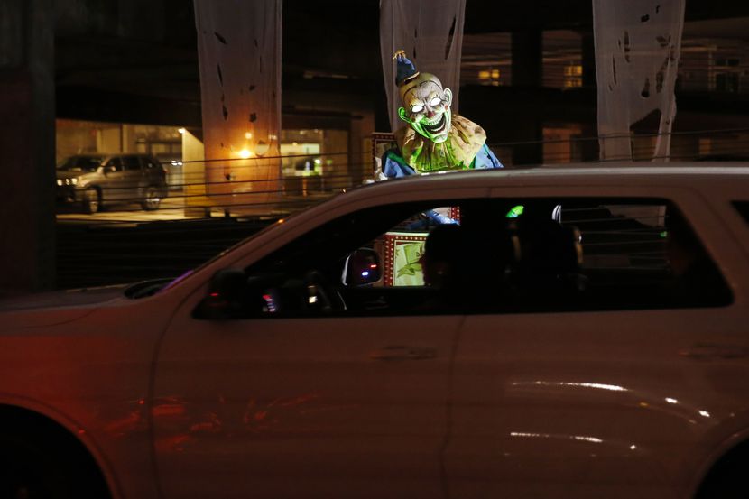 Drivers make their way through the garage during Drive Boo Halloween at American Airlines...