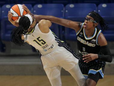 Dallas Wings guard Allisha Gray (15) is fouled by Chicago Sky guard Diamond DeShields (1) as...