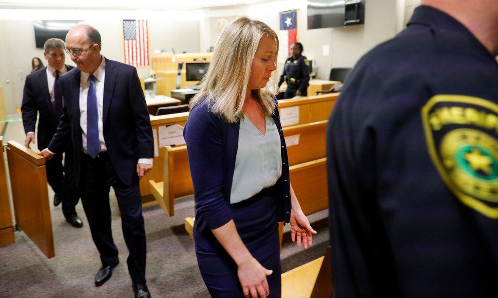 Amber Guyger is escorted from the courtroom after she was found guilty of murder on Oct. 1,...