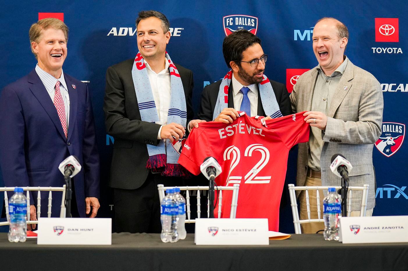 New FC Dallas head coach Nico Estévez (second from left) laughs with, from left, team chairman and CEO Clark Hunt, technical director Andre Zanotta and president Dan Hunt during his introductory press conference at the National Soccer Hall of Fame on Friday, Dec. 3, 2021, in Frisco, Texas.