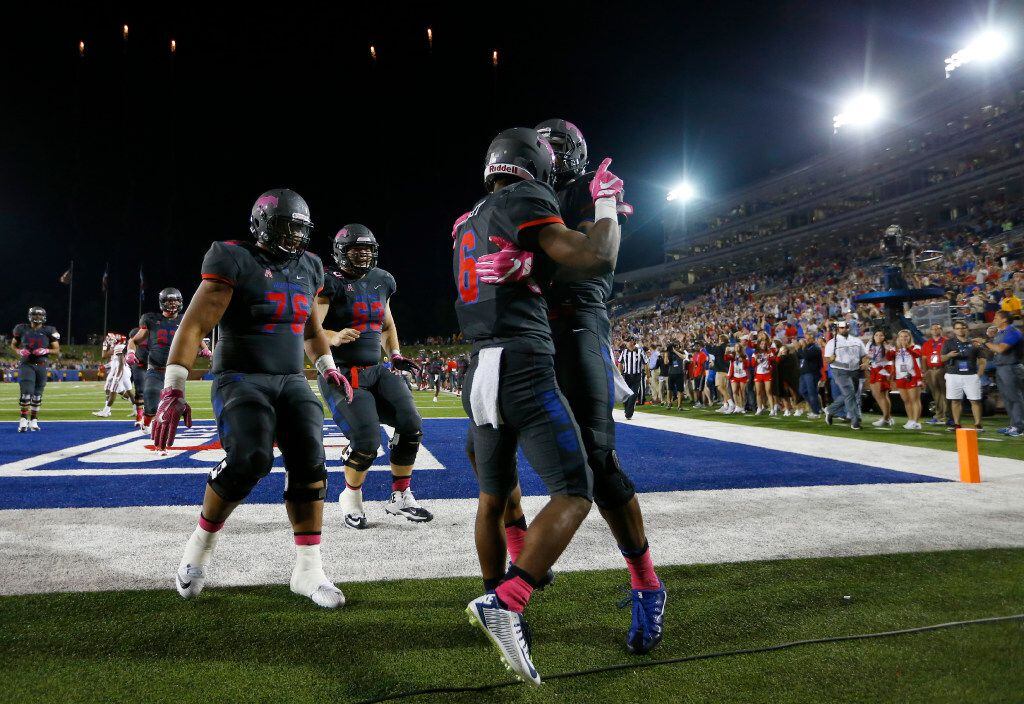 Southern Methodist Mustangs running back Braeden West (6) is congratulated by teammates...