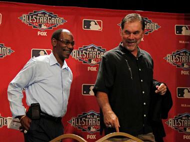Texas Rangers manager Ron Washington (left) and San Francisco Giants manager Bruce Bochy...