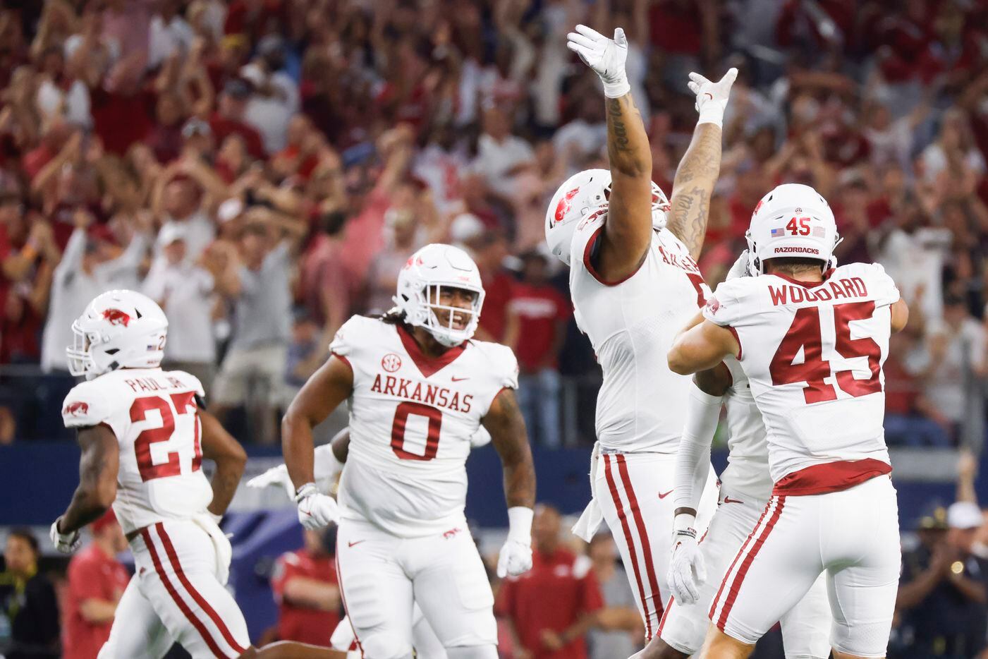 Arkansas players celebrate after intercepting during the fourth quarter of the second half...