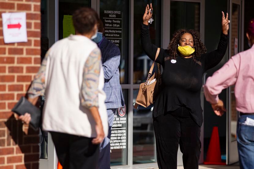 Jacqueline Johnson celebrates after voting at Disciple Central Community Church in DeSoto on...