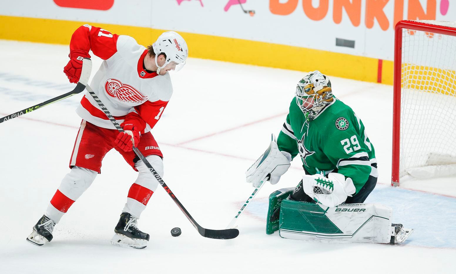 Detroit Red Wings forward Filip Zadina (11) attempts a shot as Dallas Stars goaltender Jake Oettinger (29) defends during the third period of an NHL hockey game, Tuesday, November 16, 2021. Dallas won 5-2. (Brandon Wade/Special Contributor)