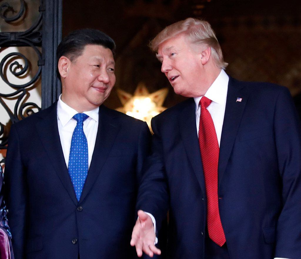 In this April 6, 2017 file photo, Chinese President Xi Jinping, left, smiles at U.S....