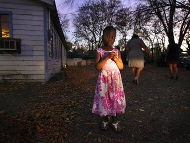 Raynasja Smith 4, leaves after services at the Liberty in Christ House of God Church. The church property had the highest lead levels found in recent testing commissioned by The Dallas Morning News. (Mona Reeder/Staff photographer)