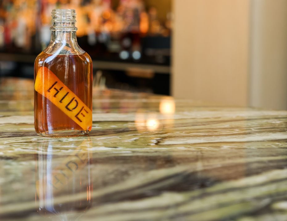 The Old Fashioned at Hide, served in a flask, is made with Woodford rye, cinnamon, angostura...