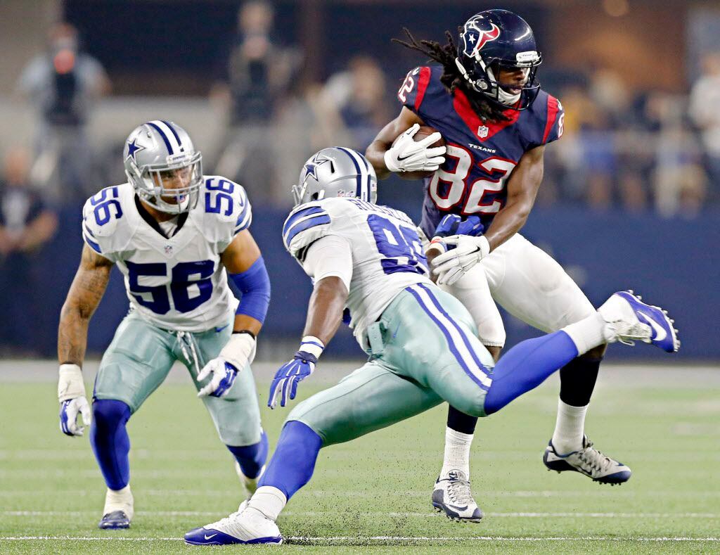Houston Texans wide receiver Keshawn Martin (82) pushes aside tackle attempt by Dallas...