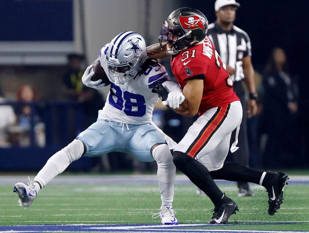 Dallas Cowboys wide receiver CeeDee Lamb (88) is tackled by Tampa Bay Buccaneers safety...